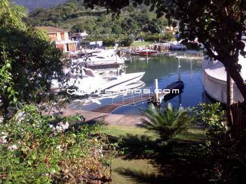 Condomínio Porto Frade - Ótima localização - A poucos passos da praia, imóvel de canal com vaga para barco na frente da casa e jardim. - 371CA